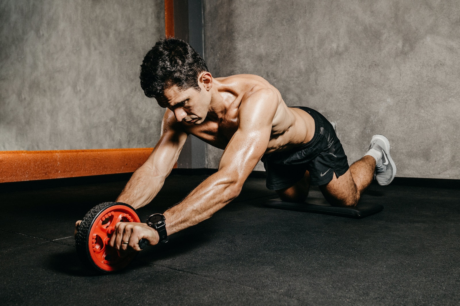 Man in Black Shorts Doing Push Up