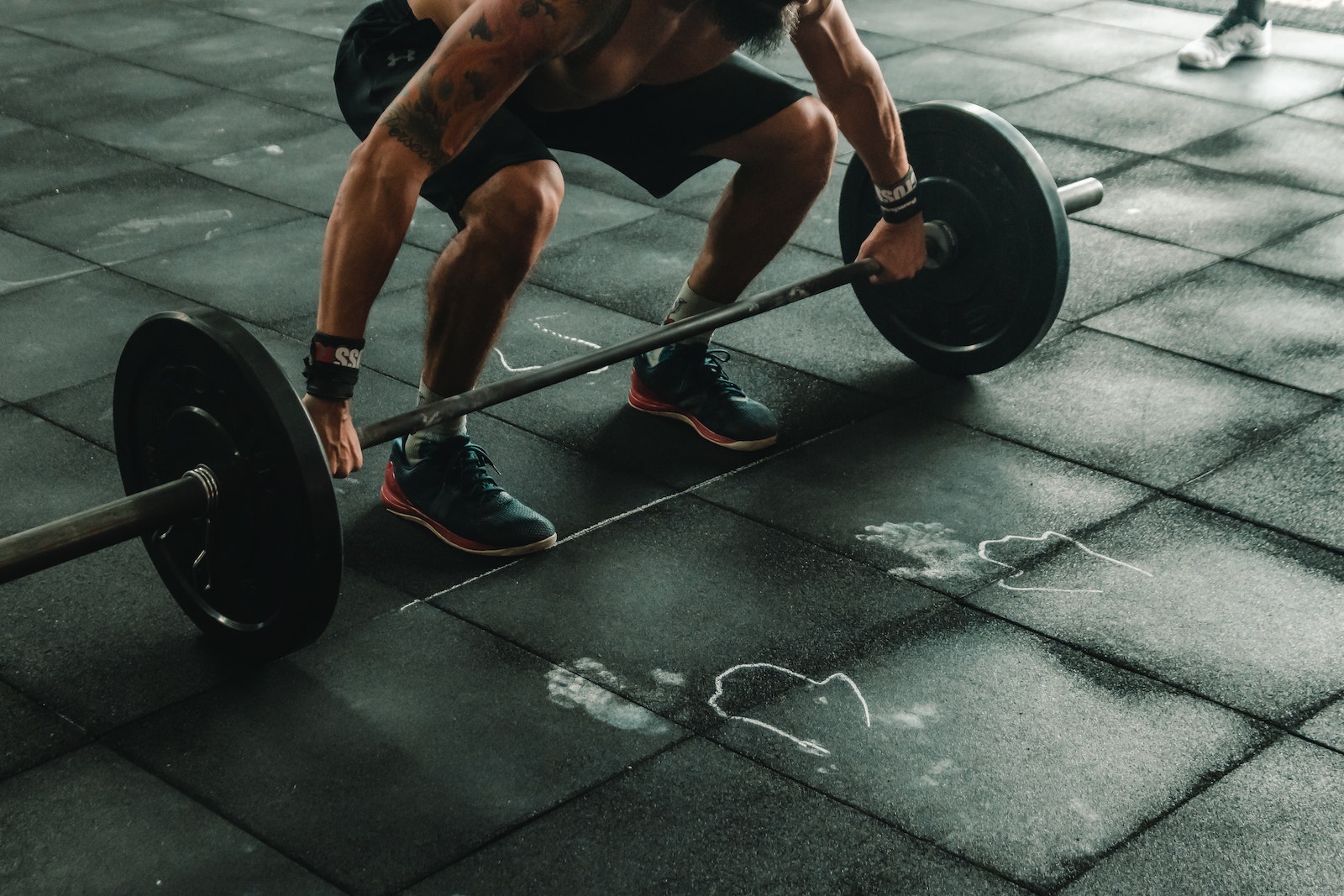 Man About to Lift Barbell