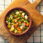 sliced vegetables in brown wooden bowl