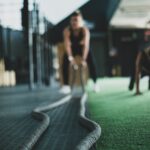 two person inside gym exercising