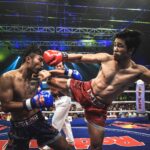 Muay Thai boxer kick opponent